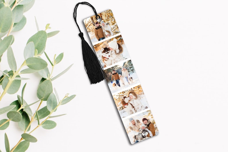 May include: A rectangular bookmark featuring a series of family photos in a winter setting. The bookmark has a black tassel attached to the top. The photos show people in winter clothing, with a dog in some of the photos.
