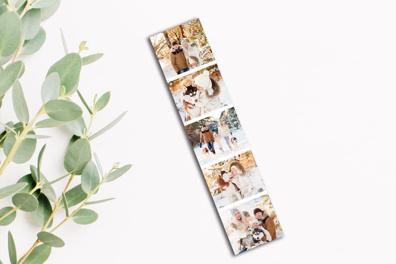 May include: A bookmark featuring a series of winter-themed photographs. The images depict people in winter clothing, some with dogs, in a snowy outdoor setting. The bookmark is a vertical rectangle with a white background.