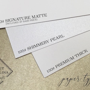 May include: Three paper samples with different textures and weights. The top sample is 100# Signature Matte, the middle sample is 105# Shimmery Pearl, and the bottom sample is 130# Premium Thick. The samples are arranged in a stack, with the top sample being the thinnest and the bottom sample being the thickest.