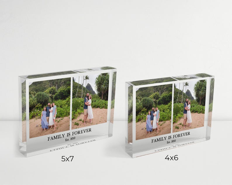 May include: Two clear acrylic photo blocks, one labeled 5x7 inches and the other 4x6 inches. Each block displays a family photo with the text "FAMILY IS FOREVER Est. 2010". The photos show people on a beach.