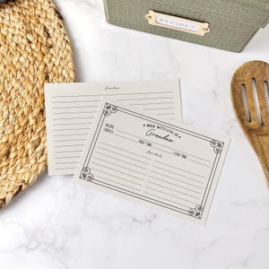 May include: A blank recipe card with a decorative border and the text "Made with love by Grandma". The card has spaces for the recipe name, servings, prep time, ingredients, and cook time.