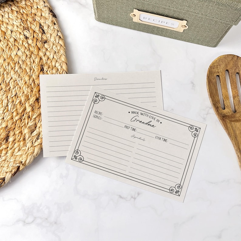 May include: A blank recipe card with a decorative border and the text "Made with love by Grandma". The card has spaces for the recipe name, servings, prep time, ingredients, and cook time.