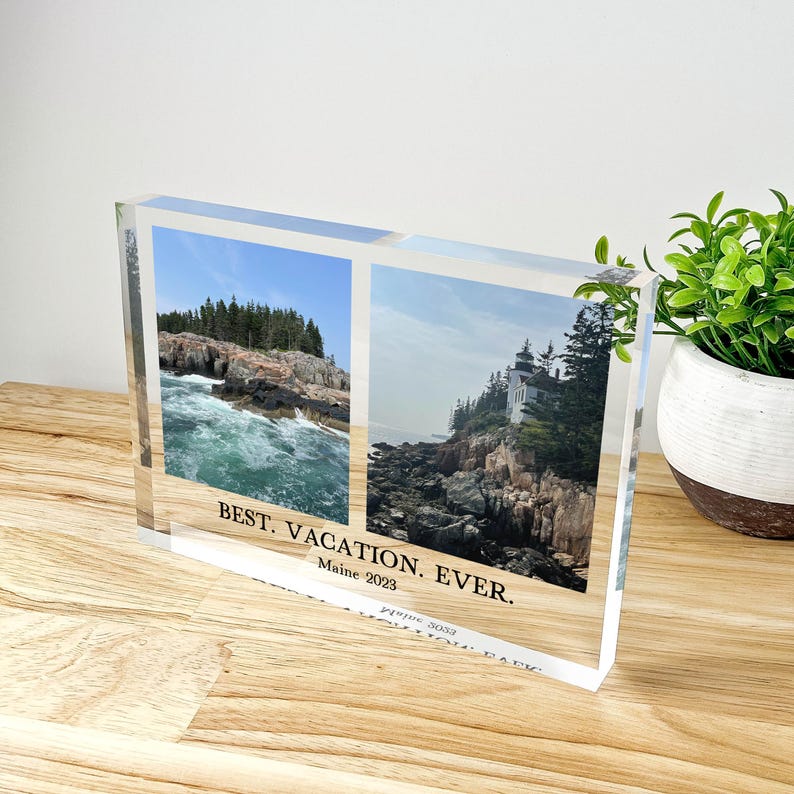 May include: A clear acrylic block featuring two landscape photos of the Maine coast. The block has the text "BEST. VACATION. EVER. Maine 2023". The photos show ocean waves, rocky shores, and a lighthouse.
