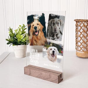 May include: A clear acrylic photo display with three dog portraits and a wooden base. The display reads "life is BETTER with dogs" and includes the names Molly, Gus & Max. The dogs are a golden retriever, a Weimaraner, and a golden retriever.
