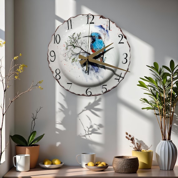 A hand-painted ceramic wall clock with original bird artwork — a genuinely one-of-a-kind functional piece you'd stop and stare at in someone's kitchen.