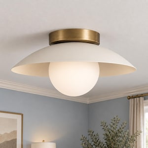 May include: A flush mount ceiling light fitting featuring a wide, matte off-white metal dome shade and a central spherical frosted glass globe. The fitting is attached to the ceiling with a circular, brushed brass-toned metal canopy mount.