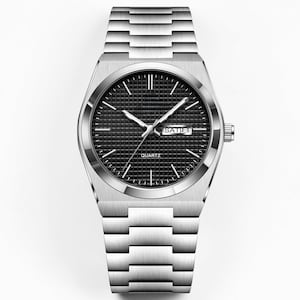 May include: A silver-toned quartz watch with a black checkered face. The watch features silver hands and markers, a date display, and a silver link band. The word "QUARTZ" is printed on the watch face.