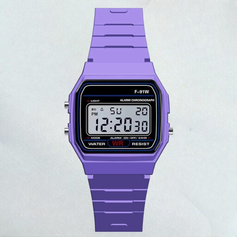 May include: A digital watch with a purple band and case. The watch face displays the time, day, and date. The watch has the text "F-91W" and other text including "ALARM CHRONOGRAPH", "WATER WR RESIST".