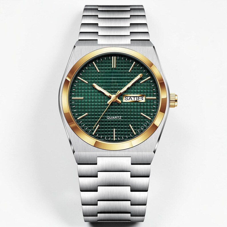 May include: A silver-toned quartz watch with a gold-colored bezel and a green textured dial. The watch features gold-colored hands and hour markers, with the day and date displayed at the 3 o'clock position. The watch band is made of silver-toned metal.
