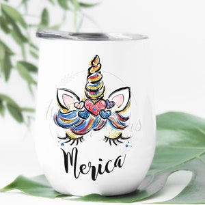 May include: White stainless steel wine tumbler featuring a red, white and blue unicorn design with the word "Merica" in black lettering.