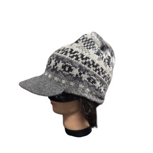 May include: A rustic wooden sign with the text "Welcome to our home" in white lettering. The sign features a distressed finish and a simple, inviting design, perfect for entryway decor.