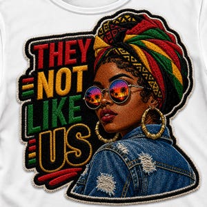 May include: A patch featuring a portrait of a woman wearing a colorful head wrap, sunglasses, and gold hoop earrings. The sunglasses reflect a sunset scene. The text "THEY NOT LIKE US" is displayed in red, yellow, green, and black.