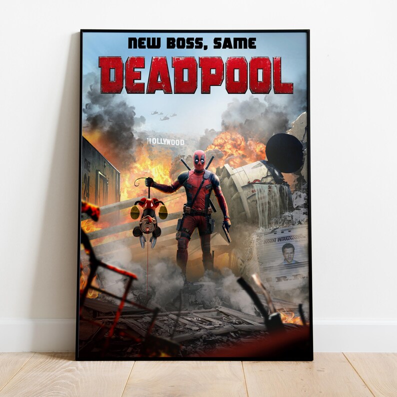 May include: A framed movie poster for Deadpool. The poster features the text "NEW BOSS, SAME DEADPOOL" in red letters. The image shows Deadpool standing in a destroyed area, holding a Mickey Mouse doll. Explosions and a Hollywood sign are in the background.