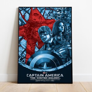 May include: A framed poster featuring Captain America and Black Widow from "Captain America: The Winter Soldier." The artwork is predominantly blue and red, with Captain America holding his shield. The title and movie logo are at the bottom.