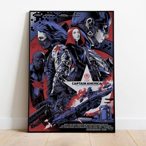 May include: A framed poster for "Captain America: The Winter Soldier" featuring Chris Evans, Scarlett Johansson, and others. The artwork has a red, blue, and black color scheme, with character portraits and the film's title prominently displayed.