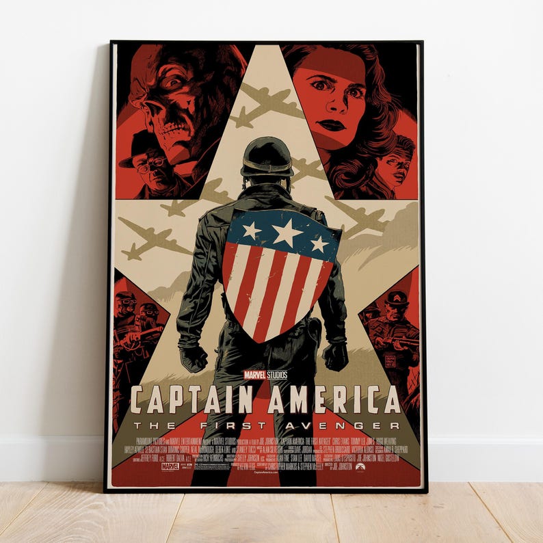 May include: A framed poster for "Captain America: The First Avenger." The artwork features Captain America from the back, holding his shield. The poster has a vintage style with a red, blue, and tan color scheme, and includes images of other characters.