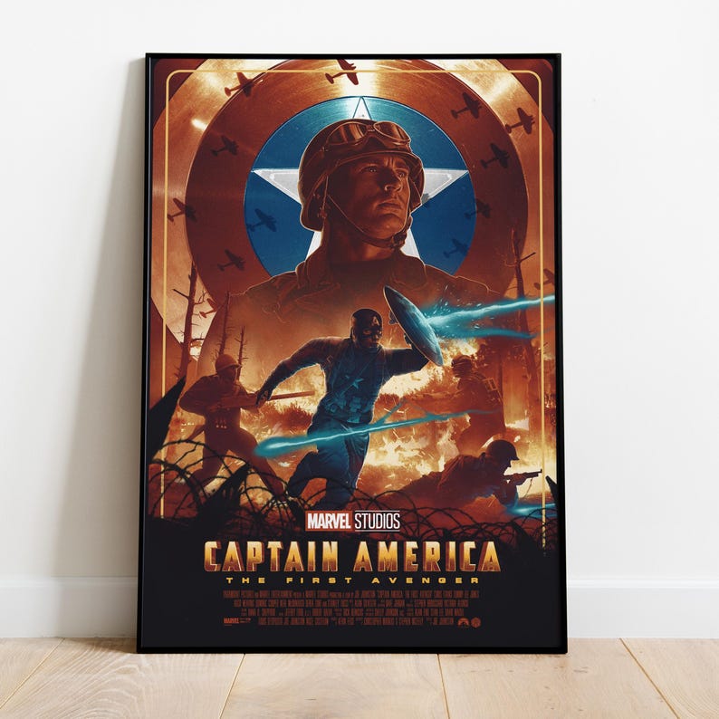 May include: A framed poster for Marvel Studios' "Captain America: The First Avenger." The artwork features a central image of Captain America, surrounded by a shield, fighter planes, and action scenes in shades of brown, blue, and orange.