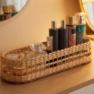 May include: A rustic wooden sign with the text "Welcome to our home" in white lettering. The sign features a distressed finish and a simple, inviting design, perfect for front door decor.