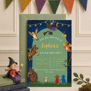 May include: A birthday party invitation featuring illustrations of characters from a children's book. The invitation is dark blue with a green arch and text that reads "You are invited to Sophia's 5th Birthday Party". A witch figurine and books are in the foreground.
