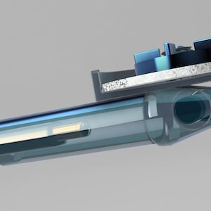 May include: A transparent, blue-tinted electronic device with a rectangular top component. The device has a cylindrical body with a rounded end and a dark, circular opening. The top component features blue and silver elements.