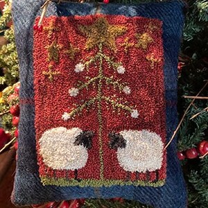 May include: A red and green wool needlepoint cushion with a Christmas tree and two white sheep. The cushion has a blue plaid border.