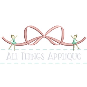 May include: A pink ribbon bow with two ballerina figures sitting on the ribbon. The text "All Things Applique" is below the ribbon.