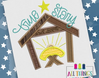 May include: A blue and yellow embroidery design of a manger with a star above it and the text "time story".