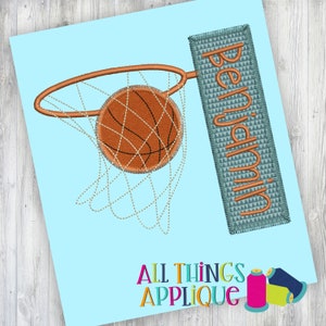 May include: An embroidered basketball hoop with a basketball in the net. The word "Benjamin" is embroidered on a rectangular patch. The background is light blue, with the words "ALL THINGS APPLIQUE" at the bottom.