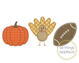 May include: Appliqué designs of a pumpkin, turkey, and American football. The pumpkin is orange with a patterned design. The turkey has a tan body and yellow and tan feathers. The football is brown with white stitching. Text reads "all things applique".