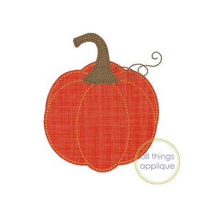 May include: A red pumpkin with a brown stem and a curly vine. The pumpkin is made of a textured fabric and has a stitched outline.