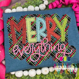 May include: A blue t-shirt with a black and white plaid design and the words "Merry Everything" in colorful letters with glitter.