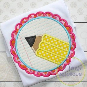 May include: A yellow pencil with white polka dots is on a blue and white sheet of paper with lines. The paper is inside a circle with a pink, orange, and blue scalloped border.