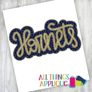 May include: Gold glitter "Hornets" applique with a navy blue background and white polka dots.