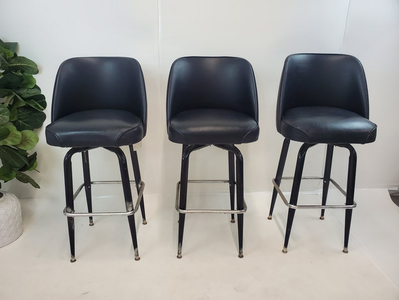 Mid Century Modern black vinyl bar stools 1960's image 1