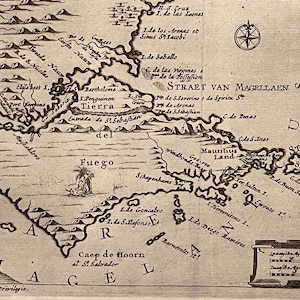 May include: Vintage black and white map of the Strait of Magellan, with detailed geographical features and text labels. A compass rose is visible. The map shows the Tierra del Fuego region, with text in a period font.