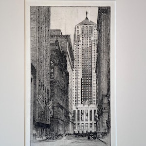 May include: A black and white etching depicting the Chicago Board of Trade building at the end of a city street. The artwork features tall skyscrapers, street-level traffic, and pedestrians. The text Chicago Board of Trade is visible on the building.