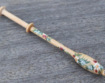 Painted Lace Bobbin - a spiral of fir branches, flowers, berries and leaves on Binche bobbin