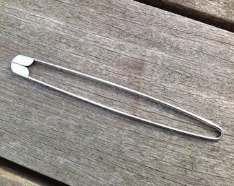 Metal stitch holder for securing Midland bobbins