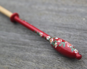 Painted Binche Lace Bobbin - a spiral of white daisies on a red background