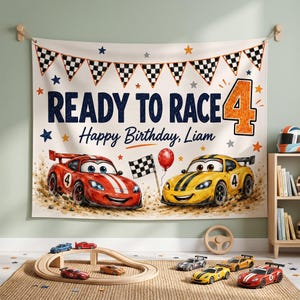 May include: A rectangular fabric backdrop featuring a racing theme with the text READY TO RACE and Happy Birthday, Liam. The design includes a large orange number 4, checkered flag bunting, and cartoon red and yellow race cars on a dirt track.