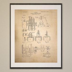 May include: Framed print of a vintage internal combustion engine patent illustration. The sepia-toned print features detailed diagrams and technical drawings of the engine's components, with text and labels. The print is encased in a black frame.
