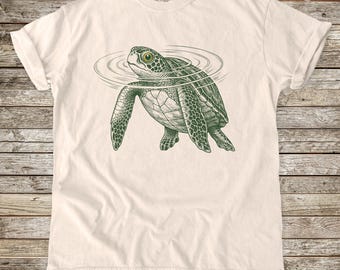 Maglietta con tartaruga galleggiante, grafica divertente di un animale, colori comodi