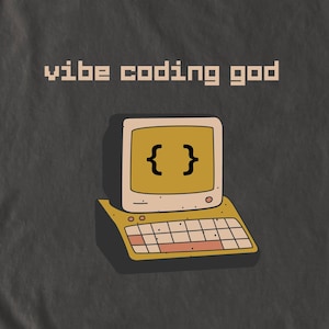 May include: A retro-style computer illustration with the text "vibe coding god." The computer has a yellow screen displaying curly brackets and a smiling face. The keyboard and base are also yellow, set against a dark gray background.