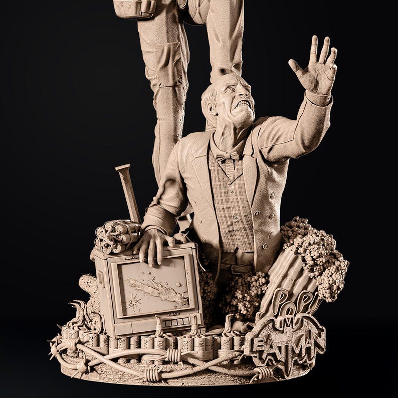 May include: A detailed sculpture of a man in a suit, reaching upwards, with a broken television and dynamite. The sculpture has a Pop! Batman logo and barbed wire details. The figure is in a neutral color.