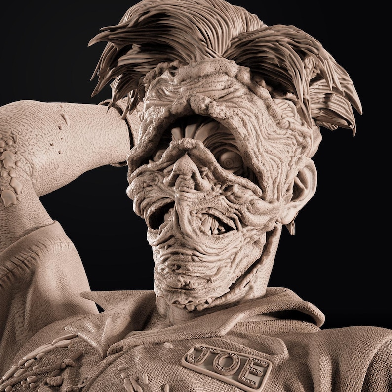 May include: A detailed sculpture of a grotesque figure with textured skin and wild hair. The figure is wearing a jacket with a "JOE" name tag. The sculpture is in a neutral color, with a dark background.