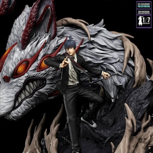 May include: A detailed figurine of a character from the anime series, Chainsaw Man. The figure is posed with a sword, standing in front of a large, stylized wolf. The wolf has red and white accents. The figure is wearing a black suit and white shirt.
