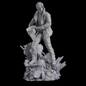 K&ouml;nnte beinhalten: Eine monochrome graue Harzfigur eines Charakters mit Kragenjacke und Hose, der eine Kettens&auml;ge in der rechten Hand h&auml;lt. Die Figur steht auf einem Sockel aus zerkl&uuml;ftetem Schutt und Tr&uuml;mmern, mit einem stacheligen, behelmten Kopf zu F&uuml;&szlig;en.