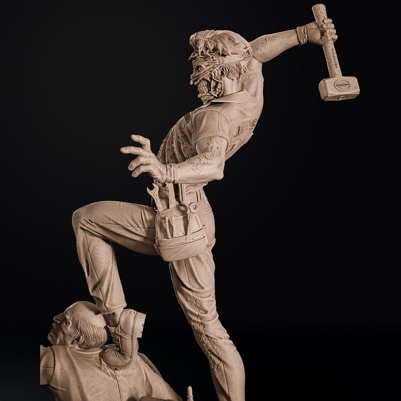 May include: A detailed sculpture of a figure in a mechanic's outfit, holding a hammer aloft. The figure is stepping on another figure. The sculpture is in a neutral color, with intricate details on the clothing and tools.