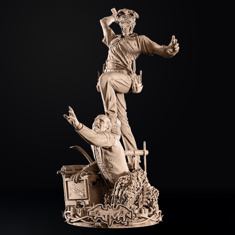 May include: A detailed sculpture of Batman villains, The Joker and The Penguin, in a dynamic pose. The Joker is standing above The Penguin. The base features the Batman logo and barbed wire. The sculpture is a neutral beige color.