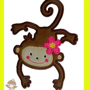 May include: A brown monkey with a pink flower on its head. The monkey is smiling and has its arms and legs outstretched.